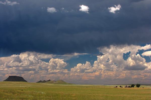 Butte and Farm with Dark Sky