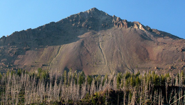 Pyramid-shaped Peak and Old Burn at Silver Gate MT