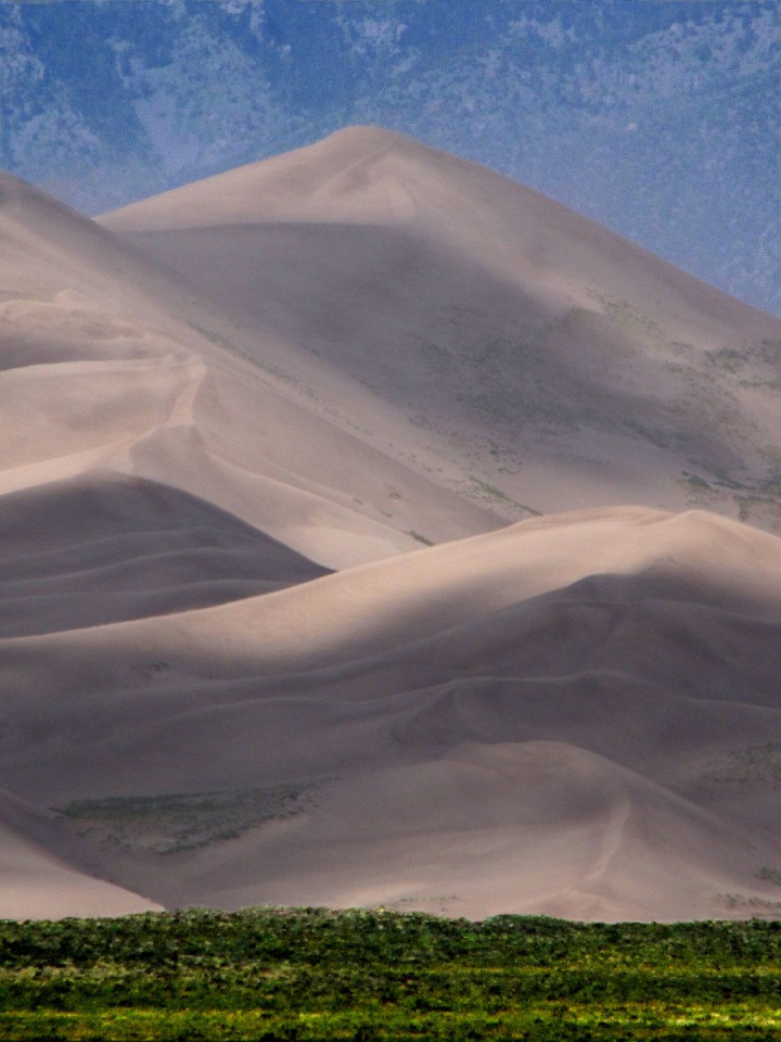 A Sand Dune "Peak" Backed By the Sangre de Cristo Mountain Range